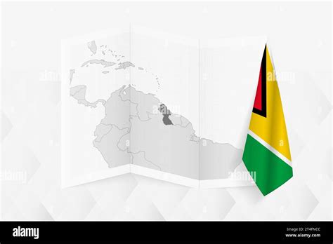 A grayscale map of Guyana with a hanging Guyanese flag on one side ...