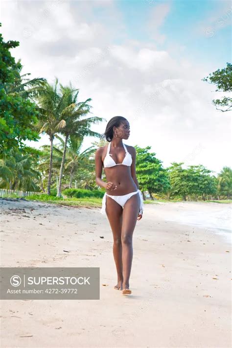 South America Brazil Bahia A Black Brazilian Model In A Bikini Woman Walks Along A Beach On