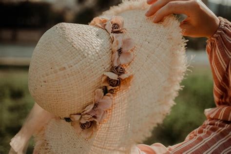 Premium Photo Close Up Of Woman Holding Hat