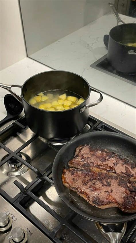 Two Pans With Food Cooking On Top Of A Stove