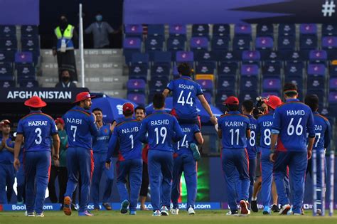 Asghar Afghan is carried by his team-mates after his final game ...