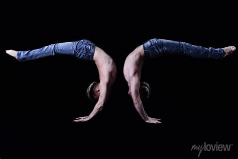 Two Twin Brothers In Blue Jeans With A Naked Torso Perform Acrobatic Wall Mural Murals