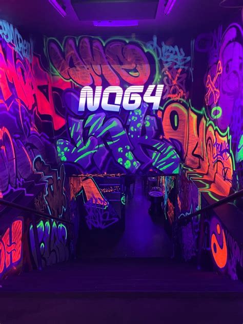 The Graffiti Wall Is Covered In Neon Colors