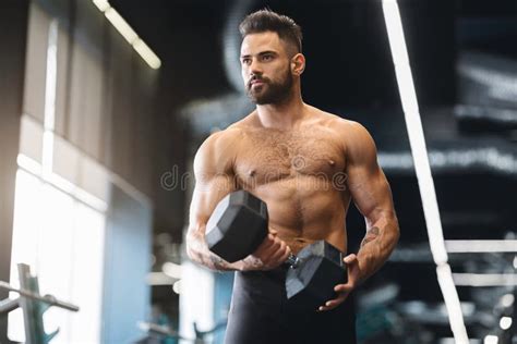 Muscular Athlete With Naked Torso Exercising With Dumbbell In Gym Stock Photo Image Of