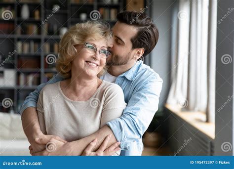 Loving Adult Son Kissing And Hugging Happy Mature Mother Stock Image Image Of Elderly Home