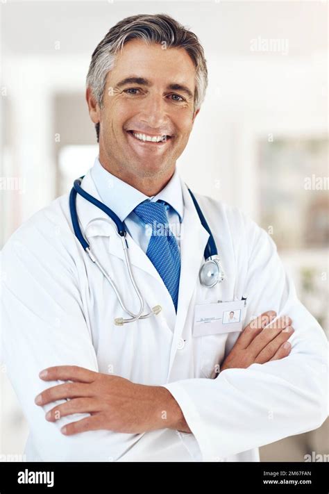 Glad To See Youre Feeling Better Cropped Portrait Of A Handsome Mature Male Doctor Standing
