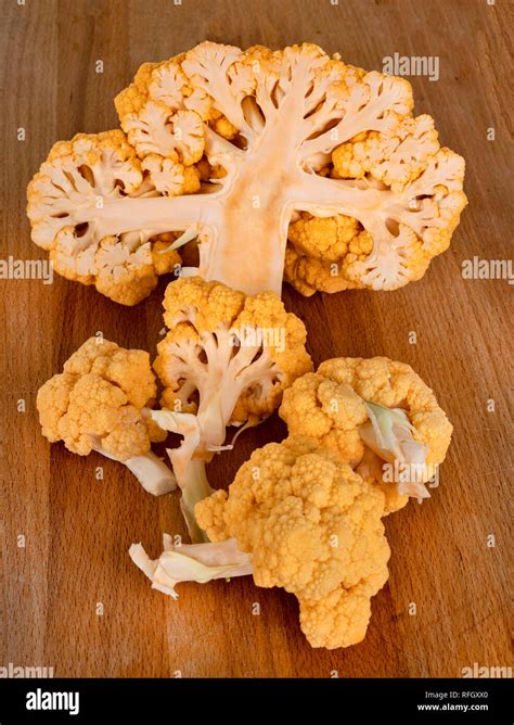 Orange Cauliflower Cabbage In Front Of White Background Stock Photo Alamy