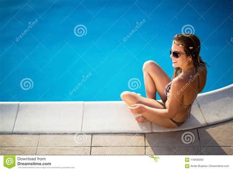 Elegant Woman In The White Bikini On The Sun Tanned Slim And Shapely Body Stock Photo Image Of