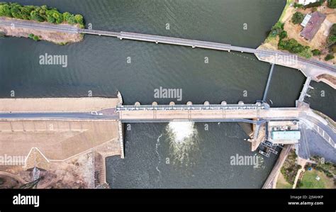 Overhead aerial view of the Lake Mulwala weir bridge between Lake Mulwala and the Murray River ...