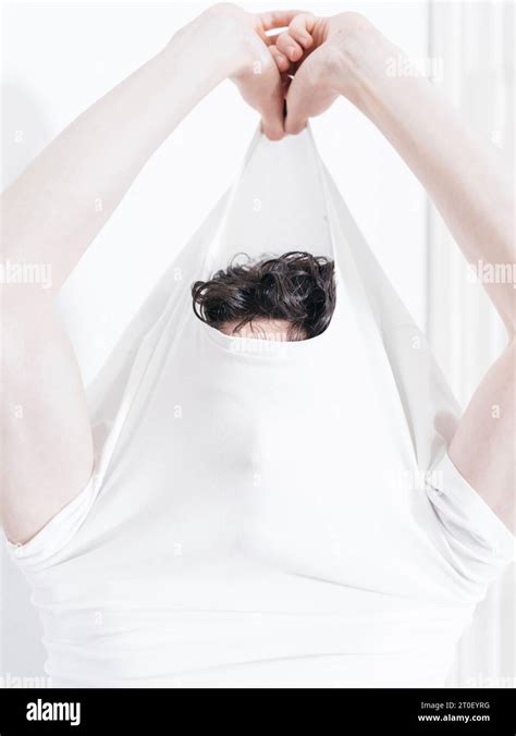 Gay Man Takes Off White Shirt Stock Photo Alamy