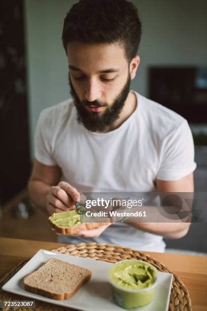 56 Man Eating Avocado Toast Stock Photos High Res Pictures And Images