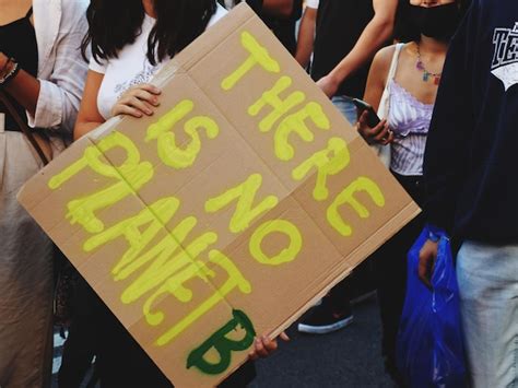 Premium Photo Midsection Of Woman Holding Poster