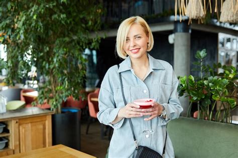 Premium Photo Beautiful Blonde Woman Relaxing At The Bar And Drinking A Cocktail Woman Having Fun