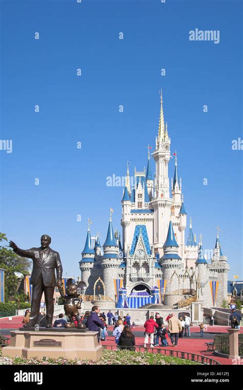 Walt Disney and Mickey Mouse Partners statue and Cinderella Castle ...