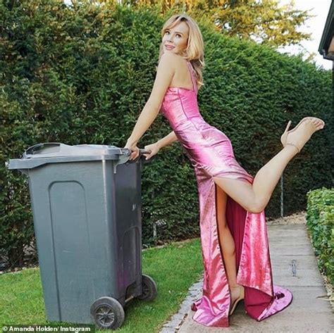 Amanda Holden Slips Into A Skimpy Pink Bikini As She Sips On Wine While Sunbathing In Her Garden