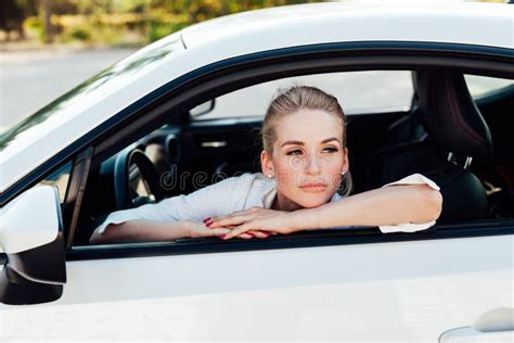 Beautiful Female Blonde Driver Behind The Wheel Of A Car On The Road Stock Photo Image Of