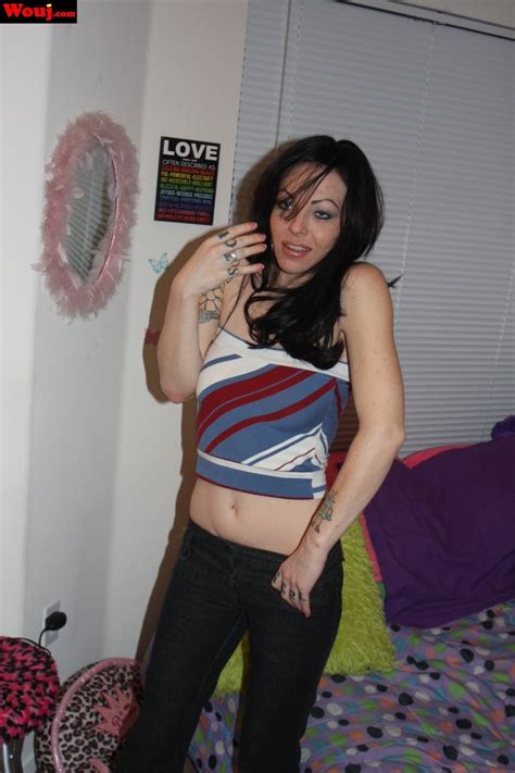 Amazing Tattooed Babe Showing Her Sexy Legs On The Couch Photos