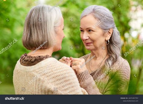 Lesbian Couple Holds Hands Smiles Each Stock Photo