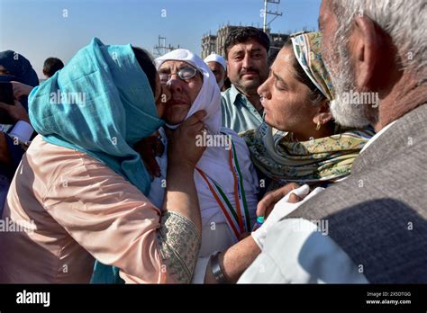 A Kashmiri Muslim Pilgrim Is Embraced By Her Relatives Before Leaving