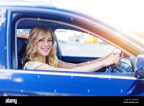 Beautiful Blonde Woman Driving A Car Stock Photo Alamy