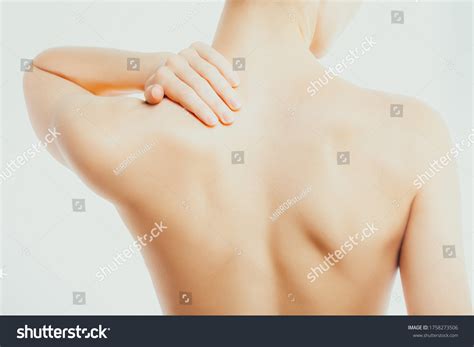 Slender Nude Woman Massages Her Neck Stock Photo Shutterstock