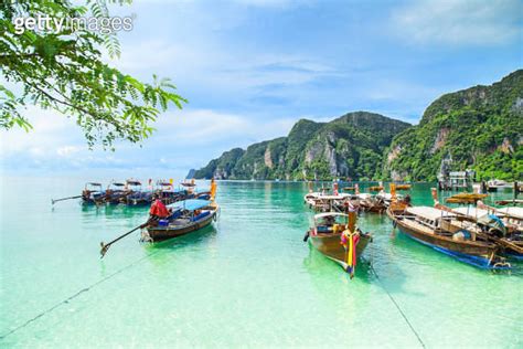 Thai Traditional Wooden Longtail Boat And Beautiful Beach In Phuket