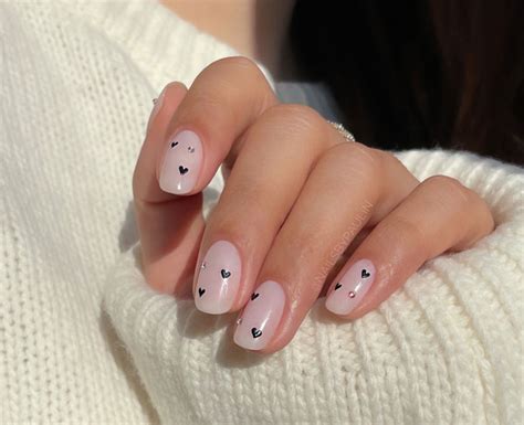 Minimalist Nude Nails With Dainty Black Hearts Valentine S Day Nails