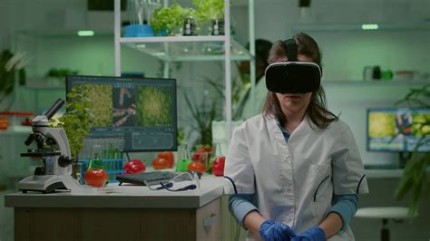 Scientist woman researcher wearing virtual reality headset developing