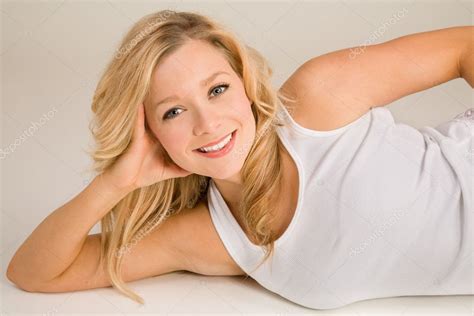 Beautiful Smiling Blonde Lying Down Stock Photo Cybernesco 2395592