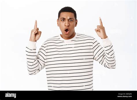 Shocked African American Man Looking Offended And Pointing Fingers Up