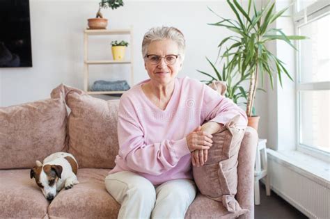 Smiling Middle Aged Mature Grey Haired Woman At Home Stock Photo