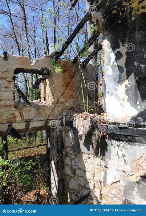 Collapsed Roof Of The Abandoned House Destroyed By The Terrible And