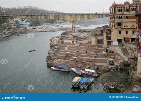 boats   small pedestrian bridge   ghats  narmada river