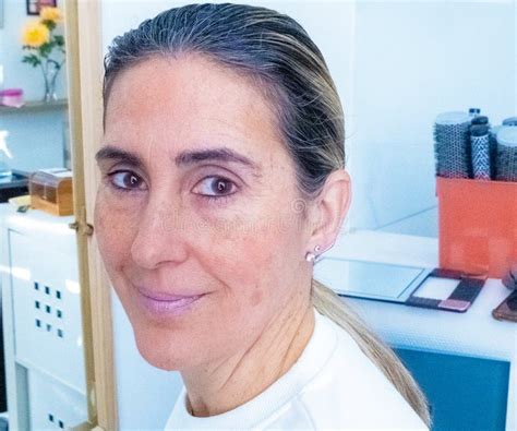 Close Up Of A Lady With Long Blonde Hair Showing A Ponytail Done With Gel Stock Photo Image Of