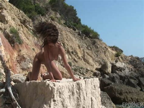 Hot Brunette On Rocks