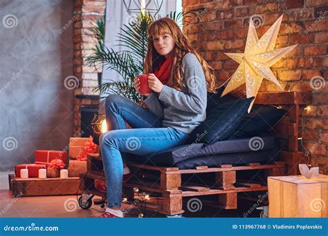 Redhead Female Drinks A Hot Coffee In A Living Room Stock Photo Image Of Espresso Furniture