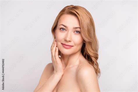 Photo Portrait Woman After Shower Smiling With Nude Shoulders Applying Cream On Cheeks Isolated