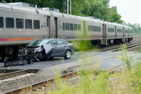 East Rutherford NJ train hits car, causing train delays