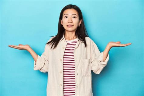 Premium Photo Asian Woman In Layered Shirt And Striped Tshirt