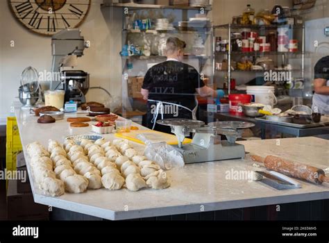 View Through The Window Of A Woman Working In An Artisan Bakery