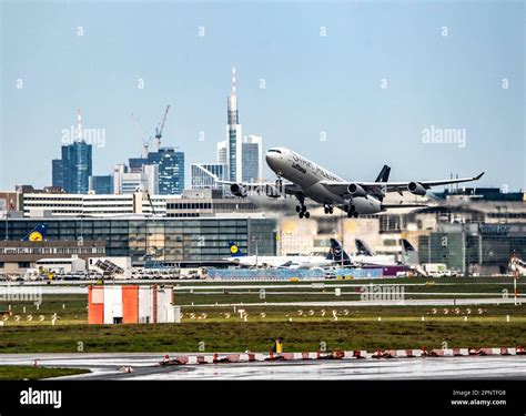 Lufthansa Airbus A340 Taking Off On The Centre Runway Skyline Of