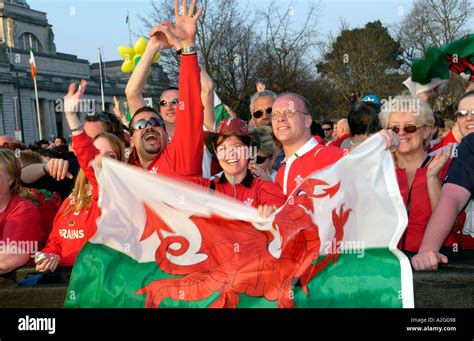 Wales Rugby Fans With Welsh Red Dragon Flags Celebrate After An