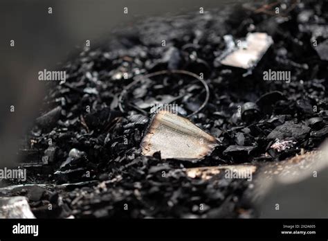 A Burnt Book On A Pile Of Ashes The Remains Of Pages In A Burnt House
