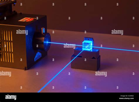 Argon Ion Laser Beam Passing Through A Beam Splitter Stock Photo