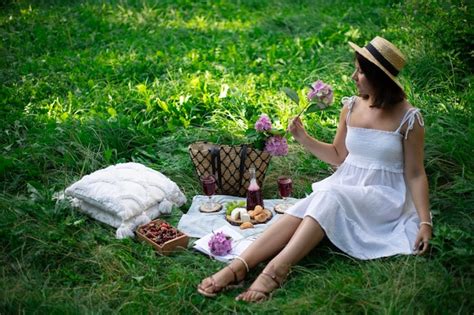 Premium Photo | A girl on a picnic on a green meadow