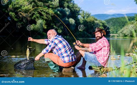 Retired Father And Mature Bearded Son Big Game Fishing Relax On Nature Fly Fish Hobby Of Men
