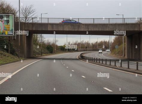 Dual Carriageway Road With Road Bridge Going Over Wirral Stock Photo