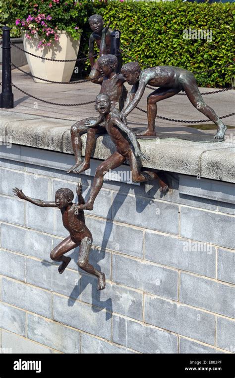 people   river statue  chong fah cheong  children jumping