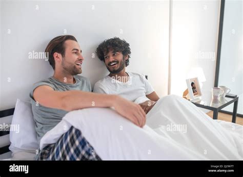 Gay Couple Having A Talk In The Bedroom Stock Photo Alamy