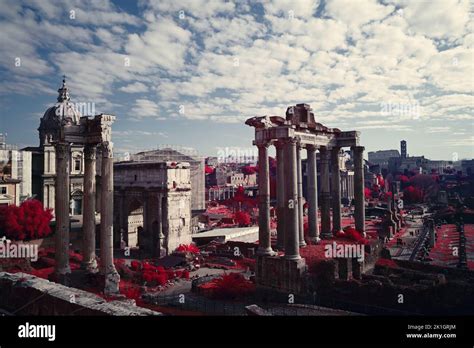 The Ruins Of The Temple Of Caesar Against The Cloudy Blue Sky Rome